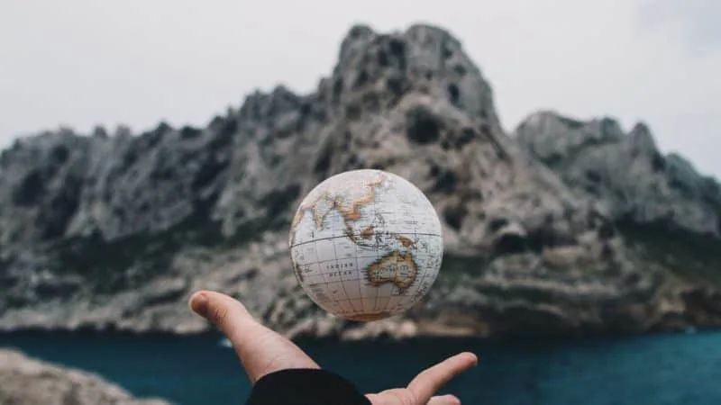 Hand holding the globe