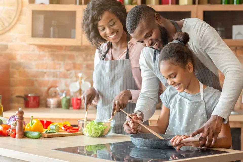 Happy family cooking in the kitchen