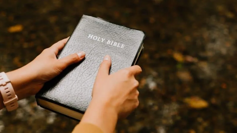 A lady holding the Bible