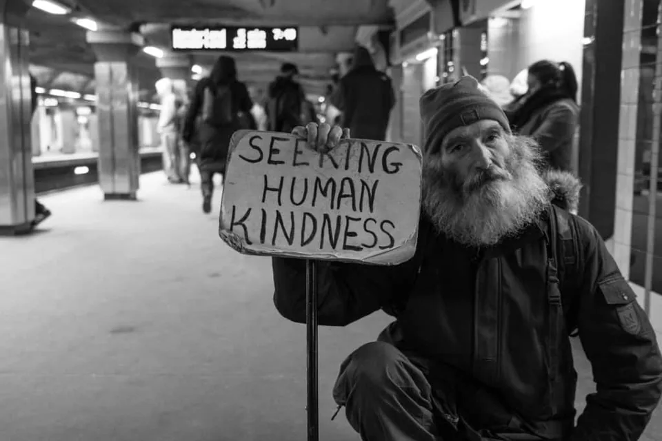 A man holding a sign