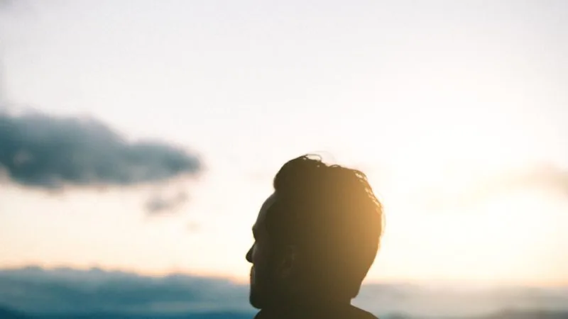 Man looking at the clouds
