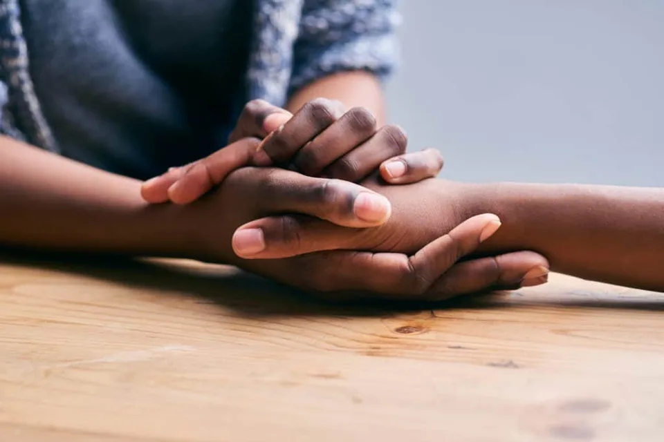 Hands holding each other