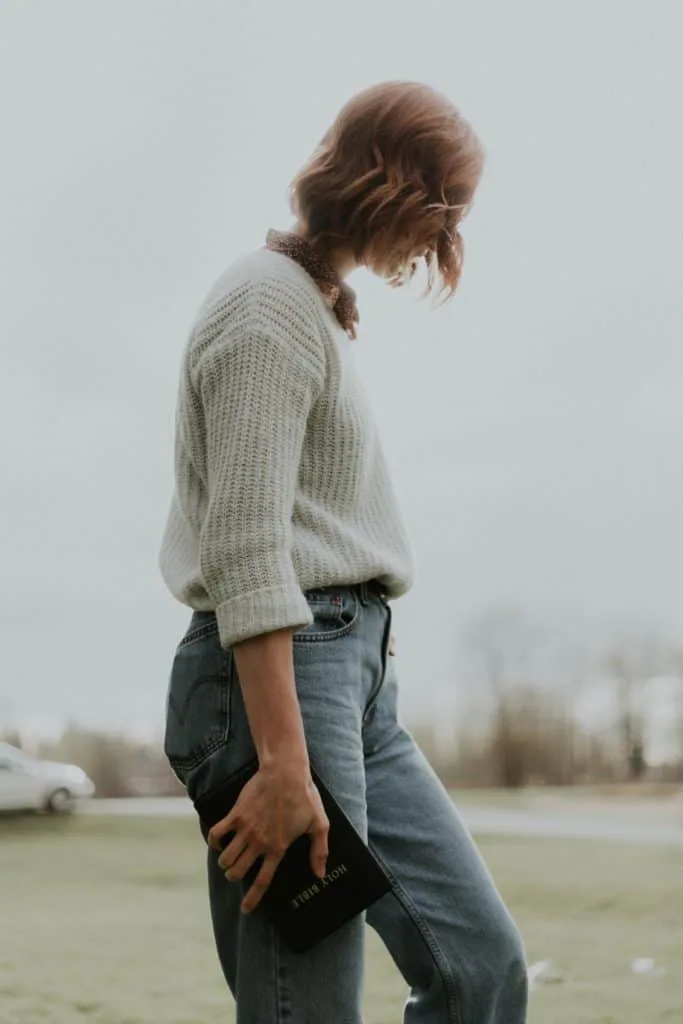 A woman holding the Bible