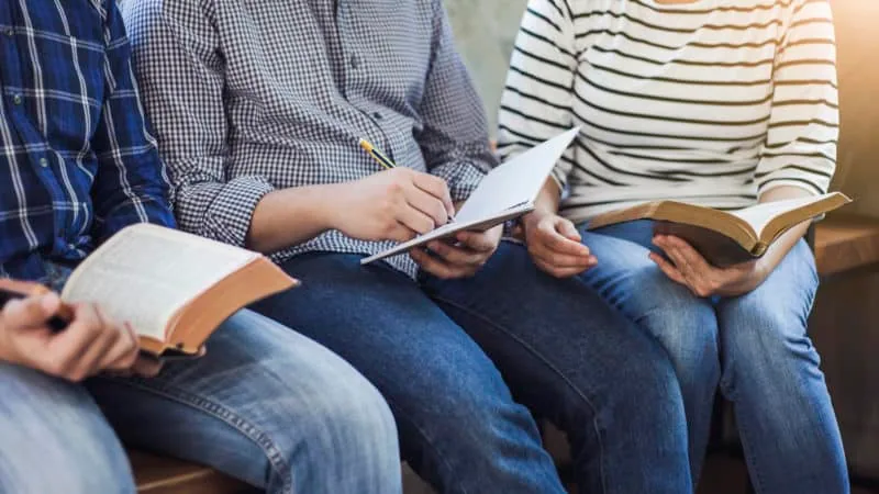 A group of people studying the Bible
