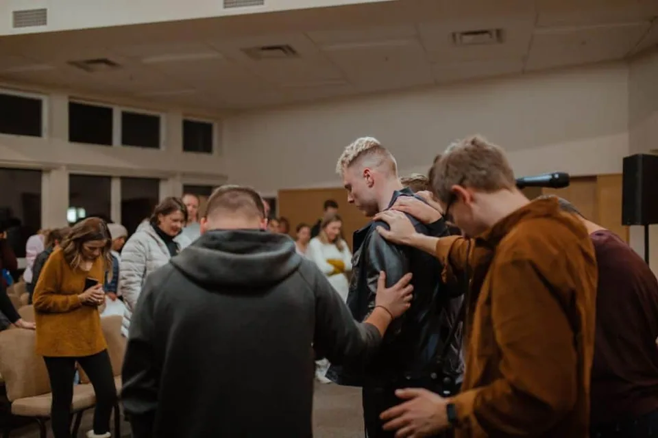 A group of people praying