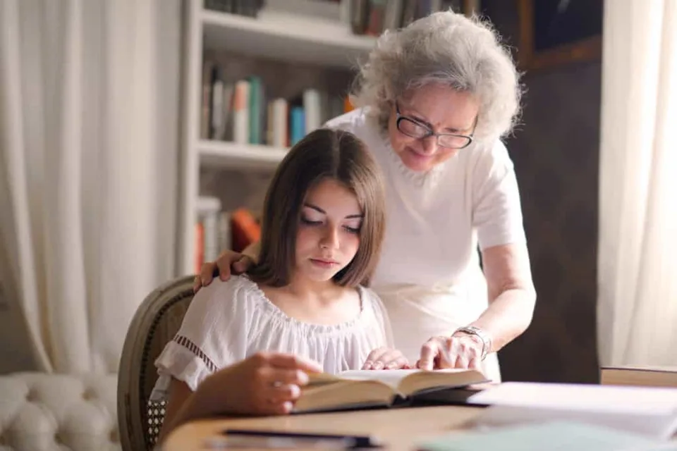Grandmother and Grand daughter reading the Bible
