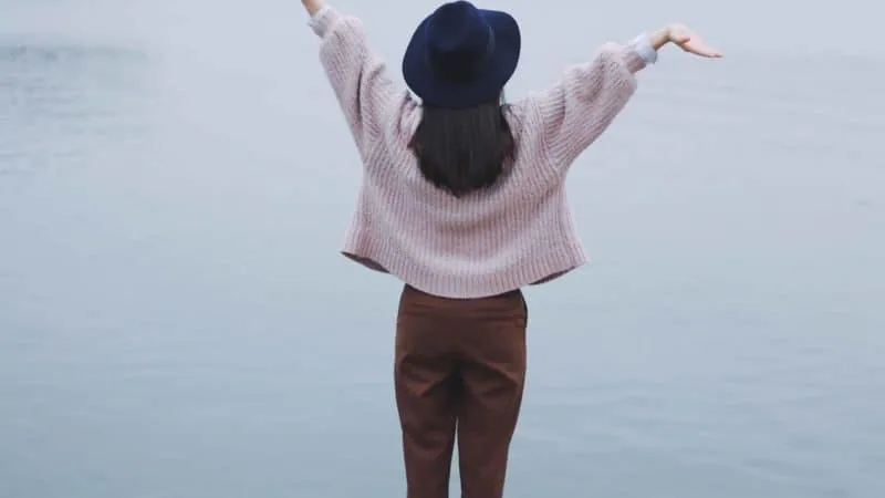 A woman lifting her hands in joy