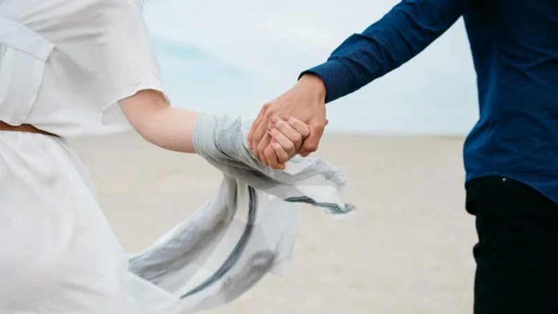 Bride and Groom holding hands with each other